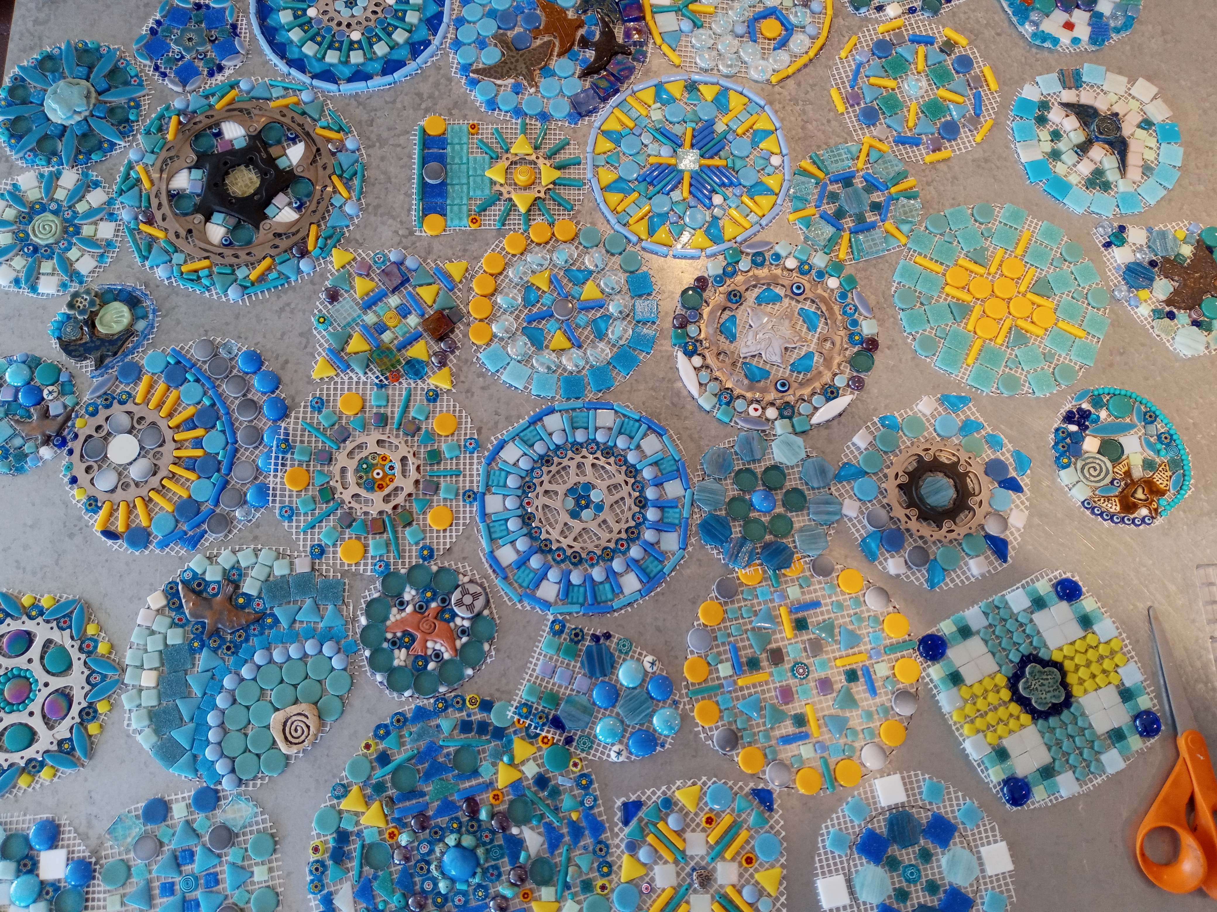 blue mosaic mandalas on a table